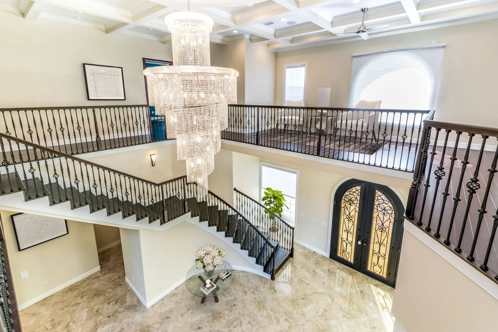 Staircase and chandelier in luxury Mediterranean home